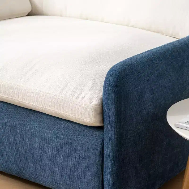 Poltrona singola in ciniglia oversize con seduta profonda e cuscini decorativi
