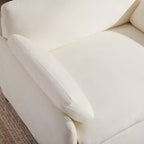 Poltrona singola in ciniglia oversize con seduta profonda e cuscini decorativi