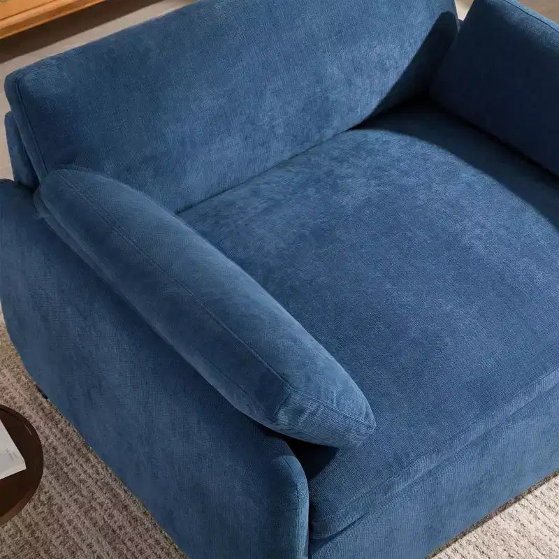 Poltrona singola in ciniglia oversize con seduta profonda e cuscini decorativi