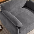 Poltrona singola in ciniglia oversize con seduta profonda e cuscini decorativi