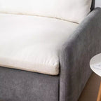 Poltrona singola in ciniglia oversize con seduta profonda e cuscini decorativi