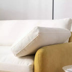 Poltrona singola in ciniglia oversize con seduta profonda e cuscini decorativi
