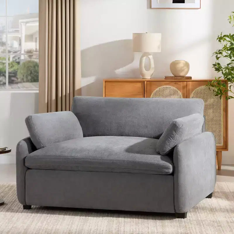 Poltrona singola in ciniglia oversize con seduta profonda e cuscini decorativi